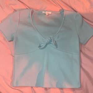 beautiful, elegant blue top. mid length, v-neck with bow